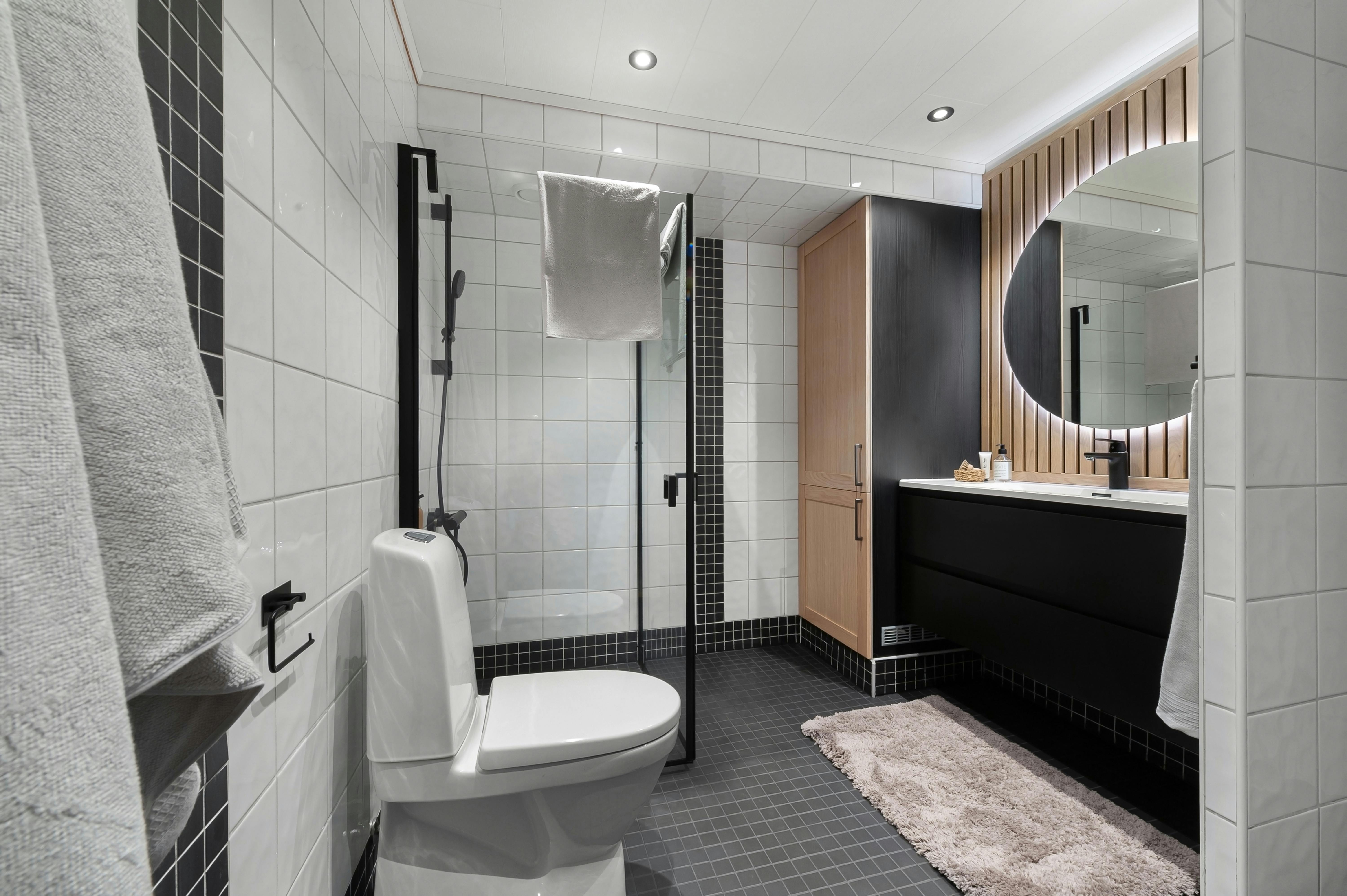 Minimalist Bathrooms Enhanced by a Black Shower Door
